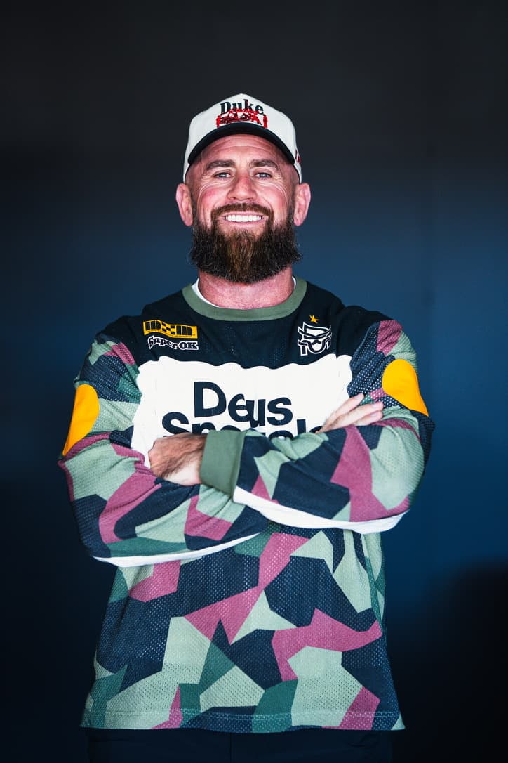 Andy Ginn smiling with arms crossed.